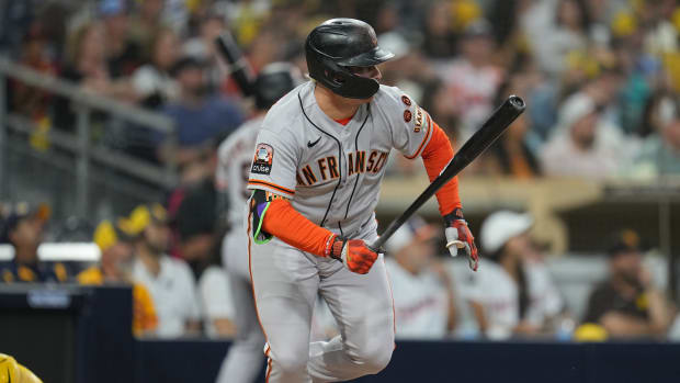 Joc Pederson hits an RBI single against the San Diego Padres at Petco Park.